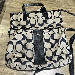 Fabric tan with black Coach C pattern